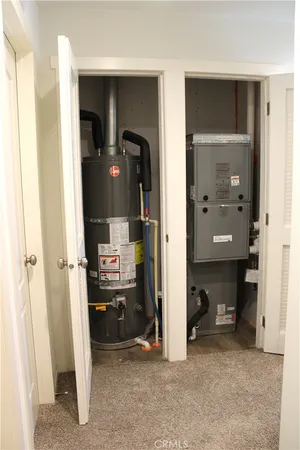 a utility room with a sink and a mirror
