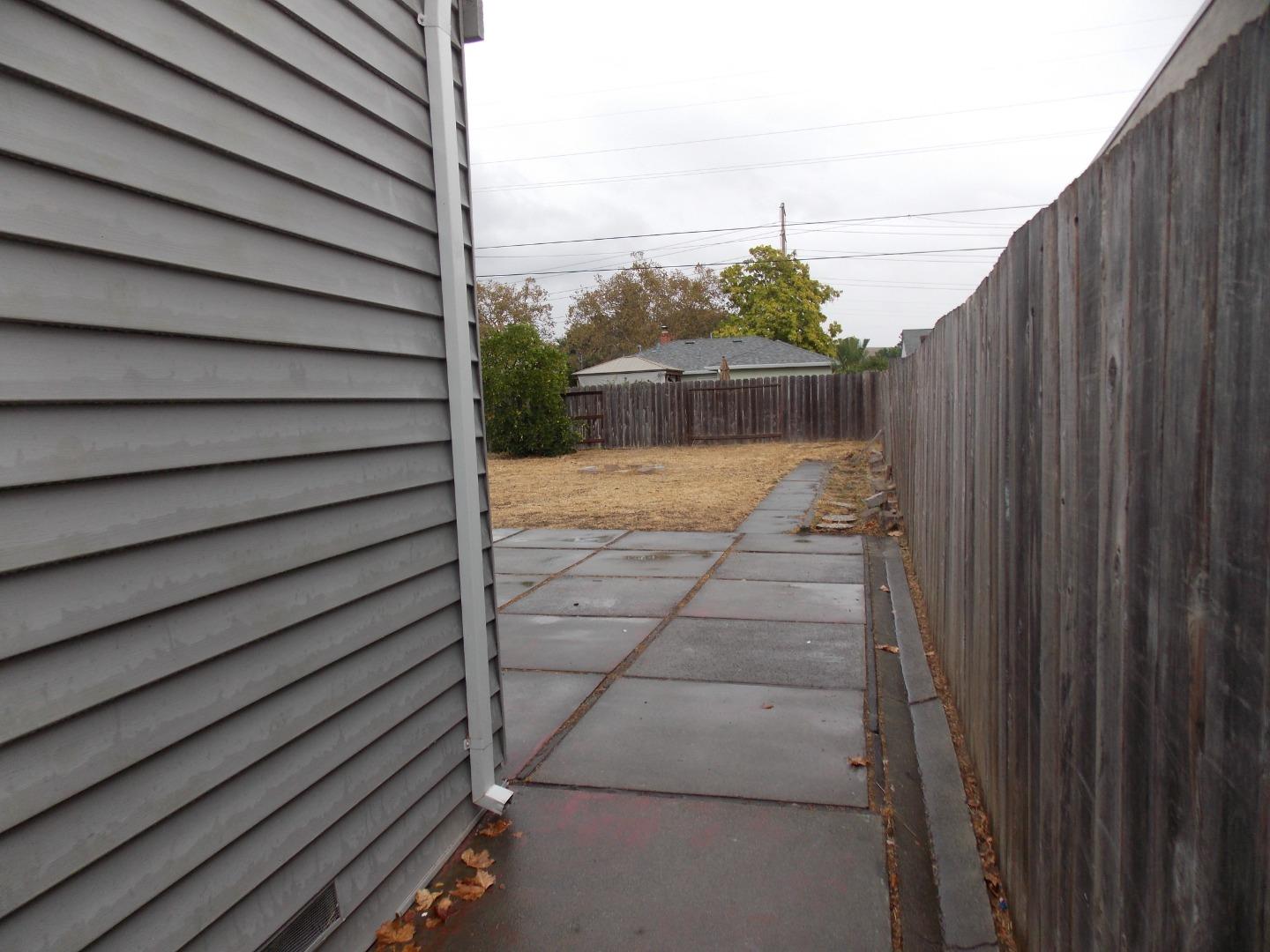 1038 Maple Avenue Vallejo, CA 94591 - Photo 11 of 13 a view of a backyard with pathway