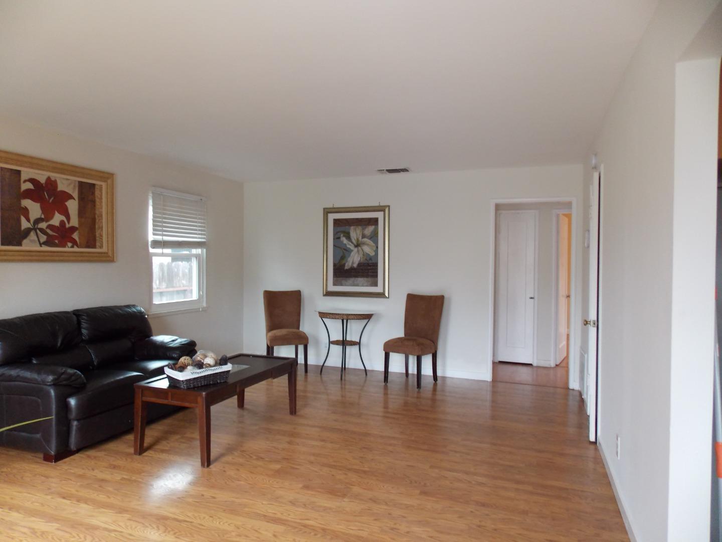 1038 Maple Avenue Vallejo, CA 94591 - Photo 3 of 13 a living room with furniture wooden floor and dining table