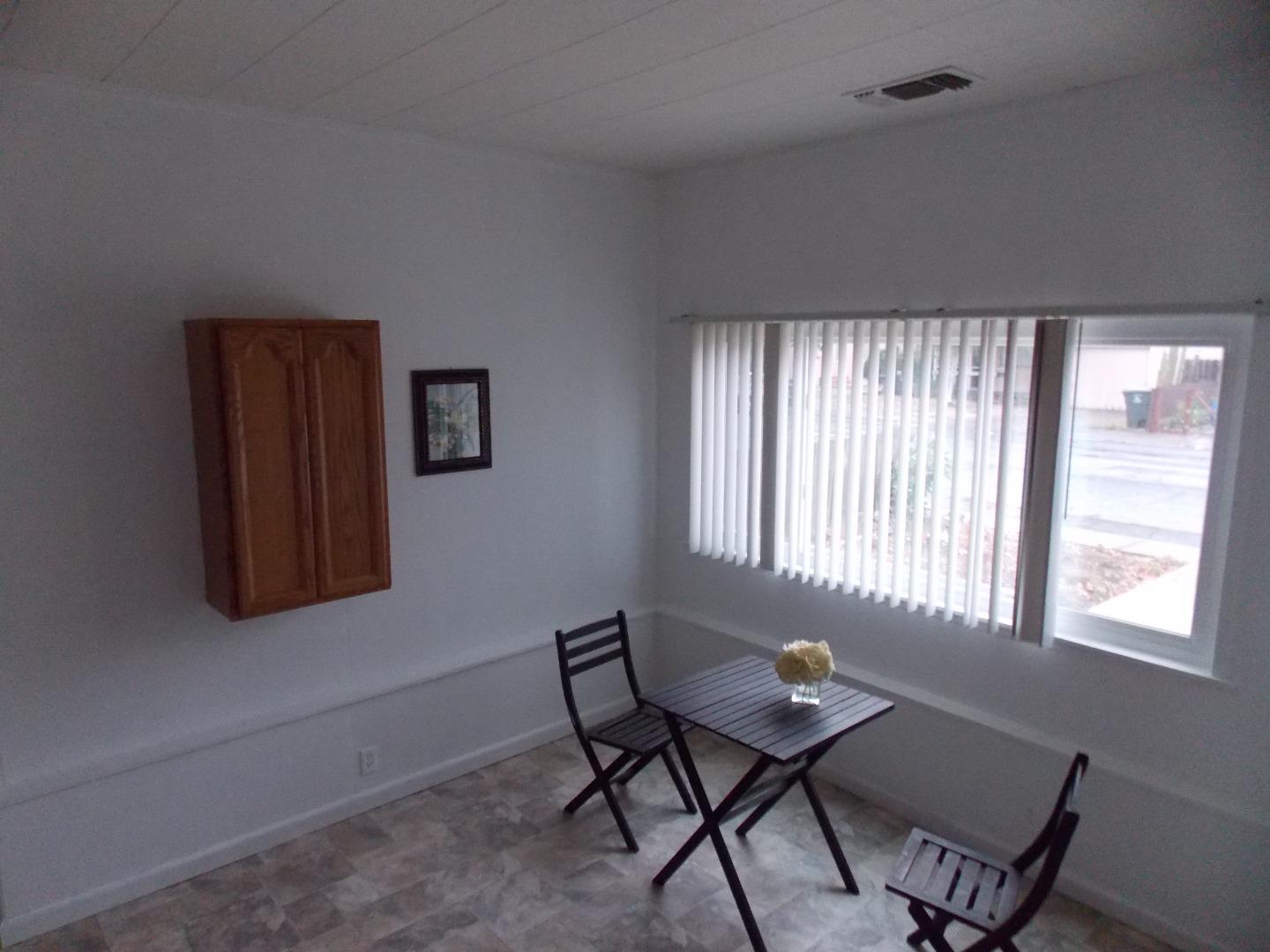 1038 Maple Avenue Vallejo, CA 94591 - Photo 7 of 13 a room with furniture and windows