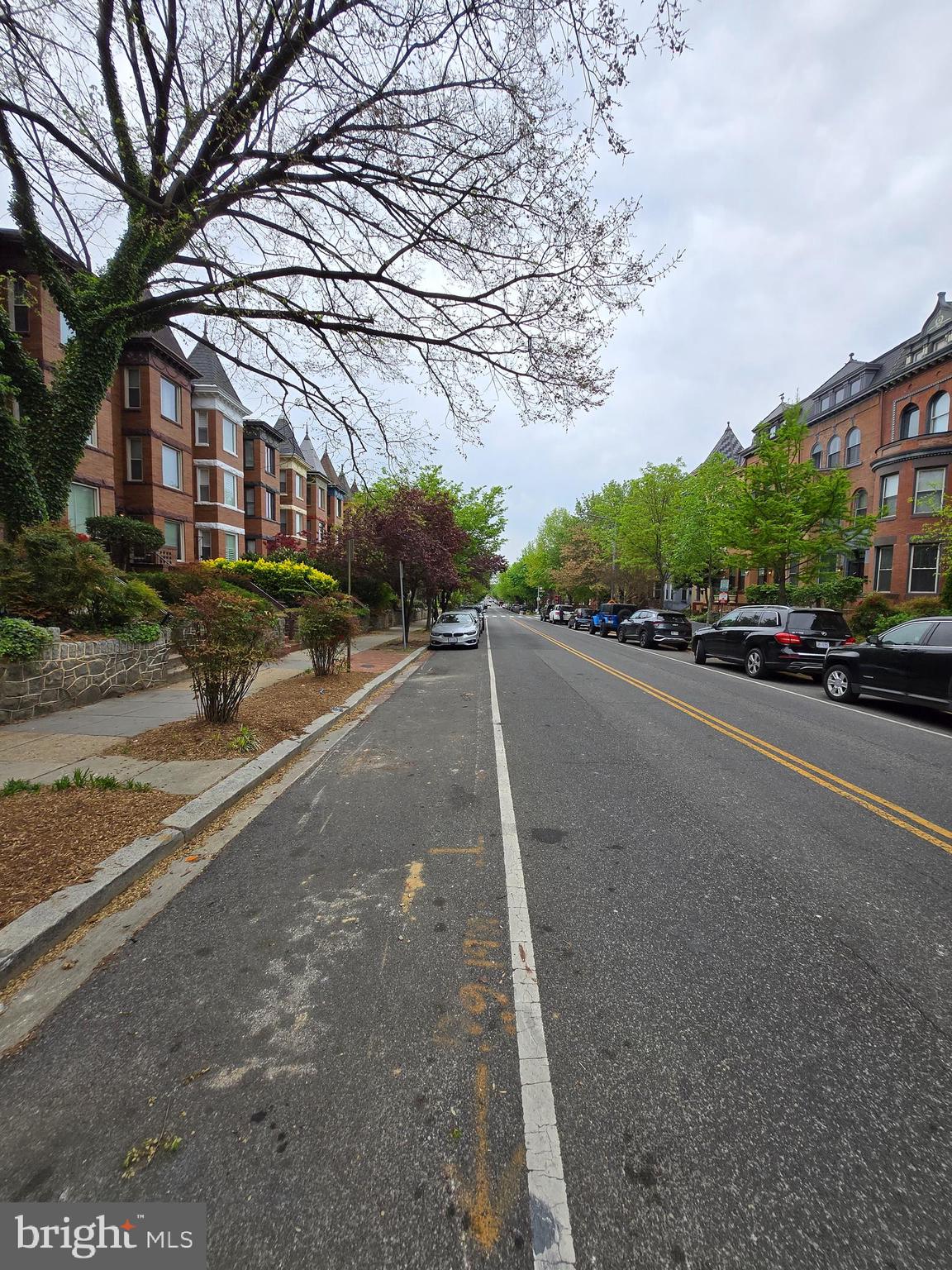 a view of street with parked cars