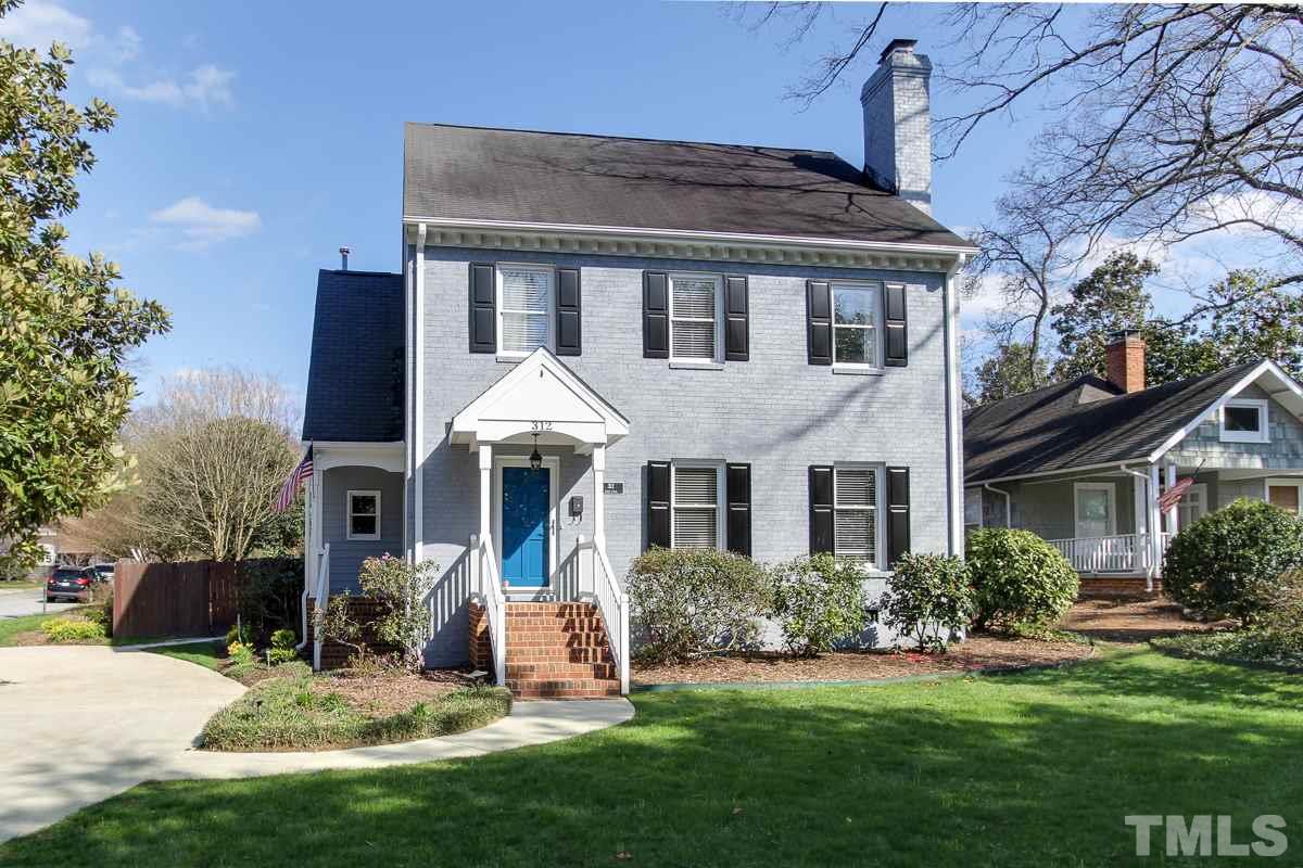 312 Dixie Trail Raleigh, NC 27607 - Photo 1 of 25 a front view of a house with a yard