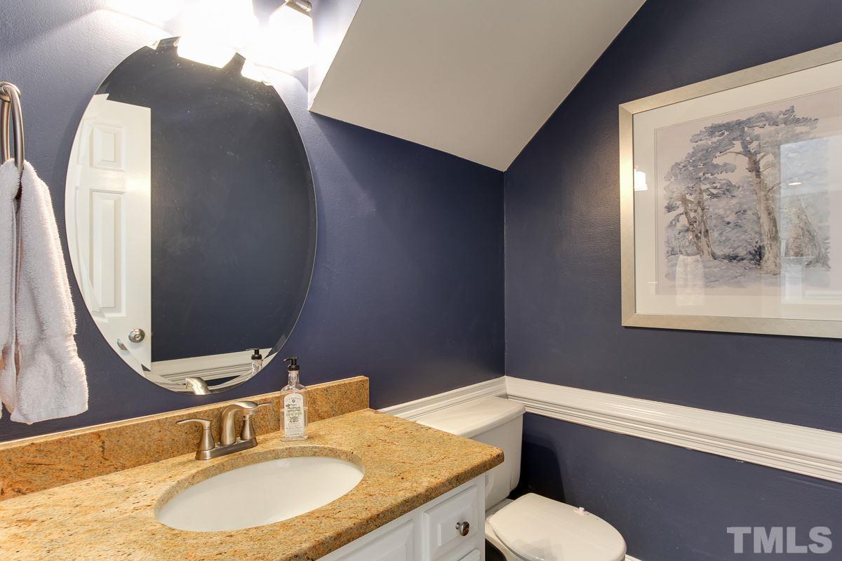 312 Dixie Trail Raleigh, NC 27607 - Photo 11 of 25 a bathroom with a granite countertop sink and a mirror