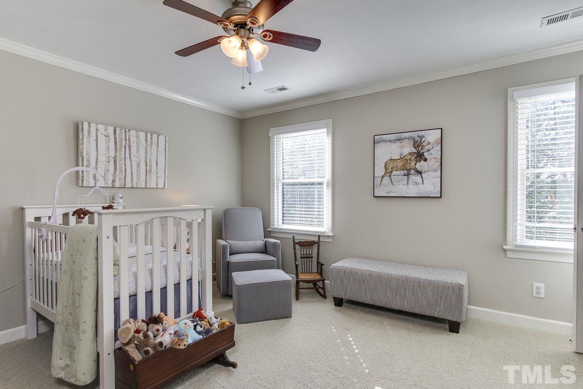 312 Dixie Trail Raleigh, NC 27607 - Photo 16 of 25 a bedroom with furniture and windows