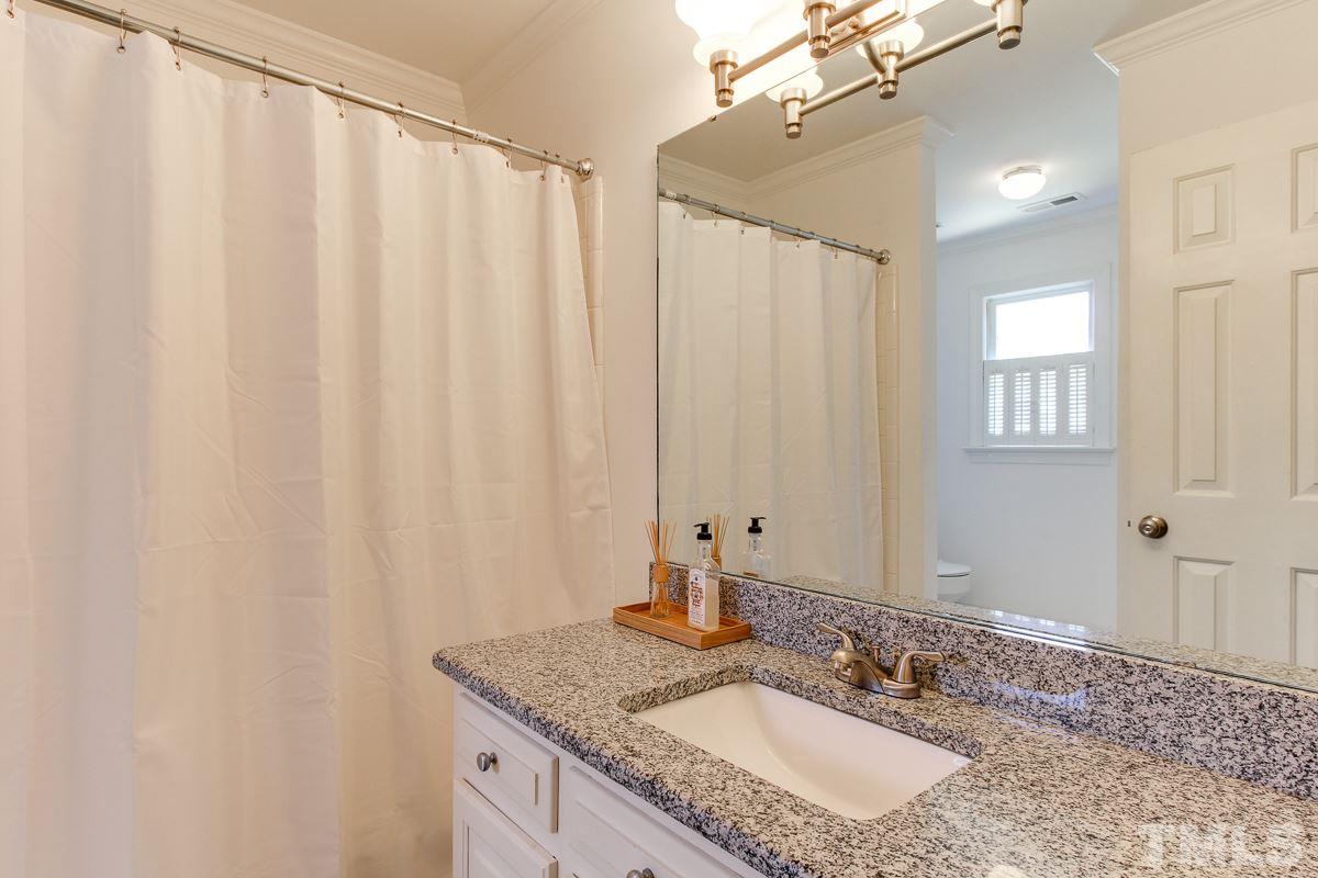 312 Dixie Trail Raleigh, NC 27607 - Photo 17 of 25 a bathroom with a granite countertop sink and a mirror