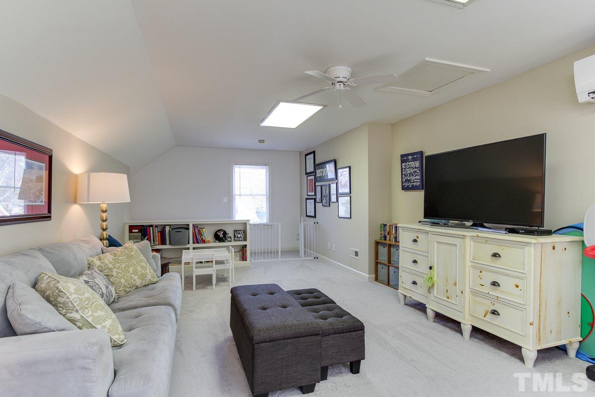 312 Dixie Trail Raleigh, NC 27607 - Photo 19 of 25 a living room with furniture and a flat screen tv