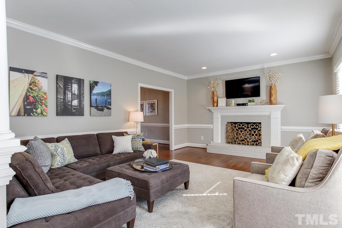 312 Dixie Trail Raleigh, NC 27607 - Photo 3 of 25 a living room with furniture and a flat screen tv