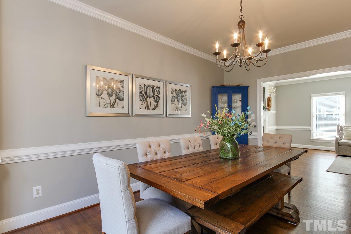 312 Dixie Trail Raleigh, NC 27607 - Photo 10 of 25 a view of a dining room with furniture and chandelier
