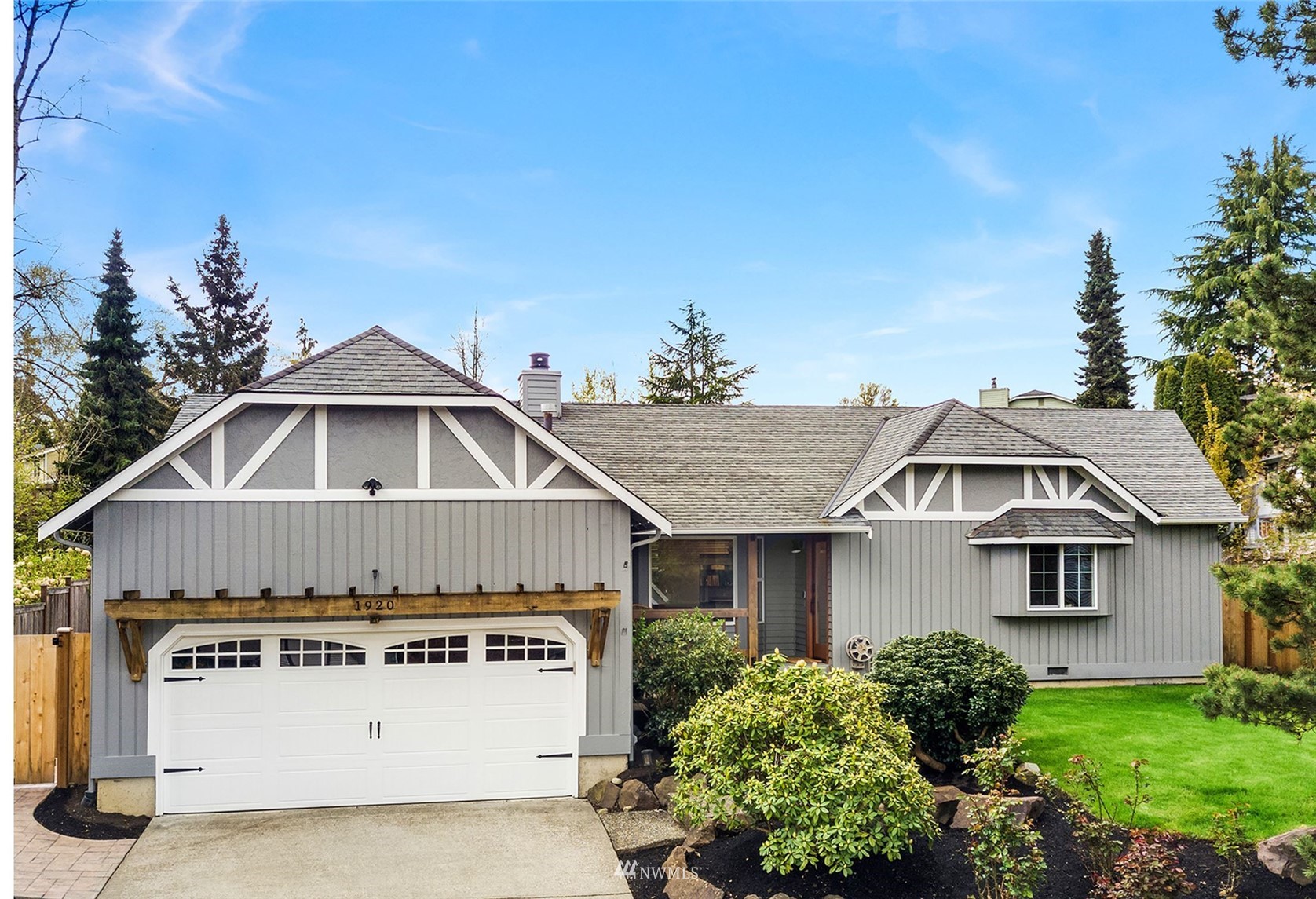 1920 233rd Place Southeast Bothell, WA 98021 - Photo 1 of 29 a front view of a house with a yard