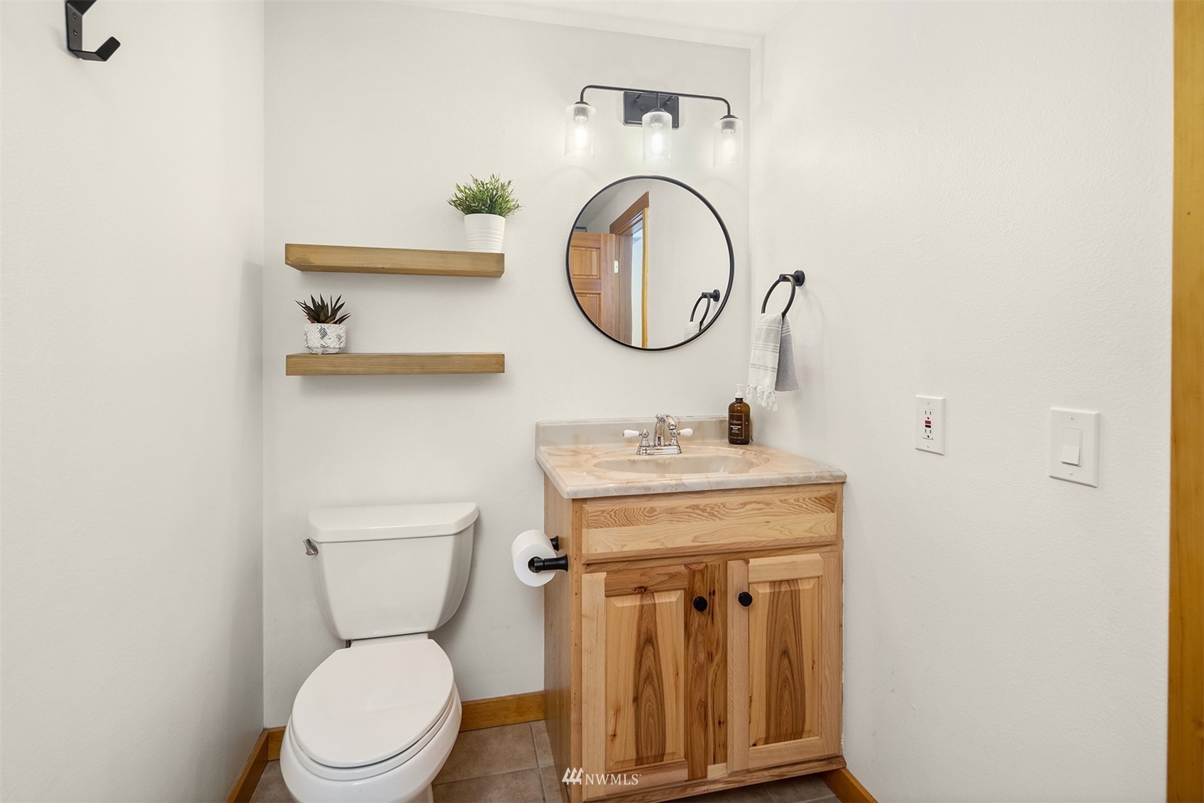 1920 233rd Place Southeast Bothell, WA 98021 - Photo 13 of 29 a bathroom with a toilet a sink and a mirror