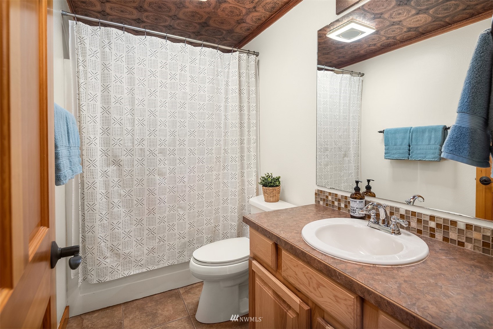 1920 233rd Place Southeast Bothell, WA 98021 - Photo 19 of 29 a bathroom with a sink and a mirror