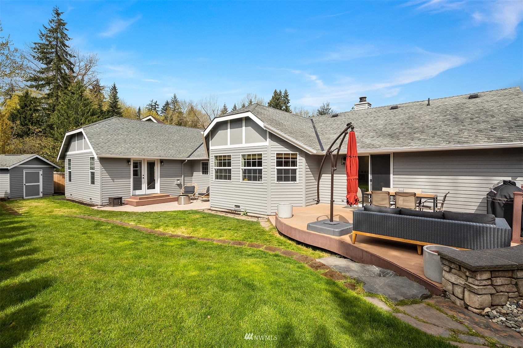 1920 233rd Place Southeast Bothell, WA 98021 - Photo 25 of 29 a front view of a house with swimming pool having outdoor seating