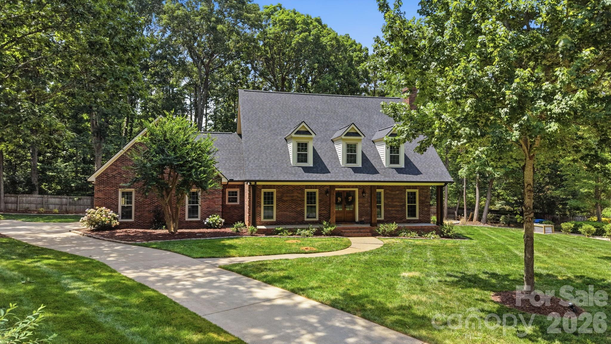 5243 Mintridge Road Mint Hill, NC 28227 - Photo 43 of 43 a front view of a house with a yard table and chairs