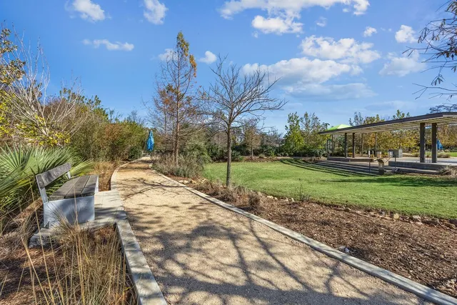 a utility room with a cabinet and a refrigerator