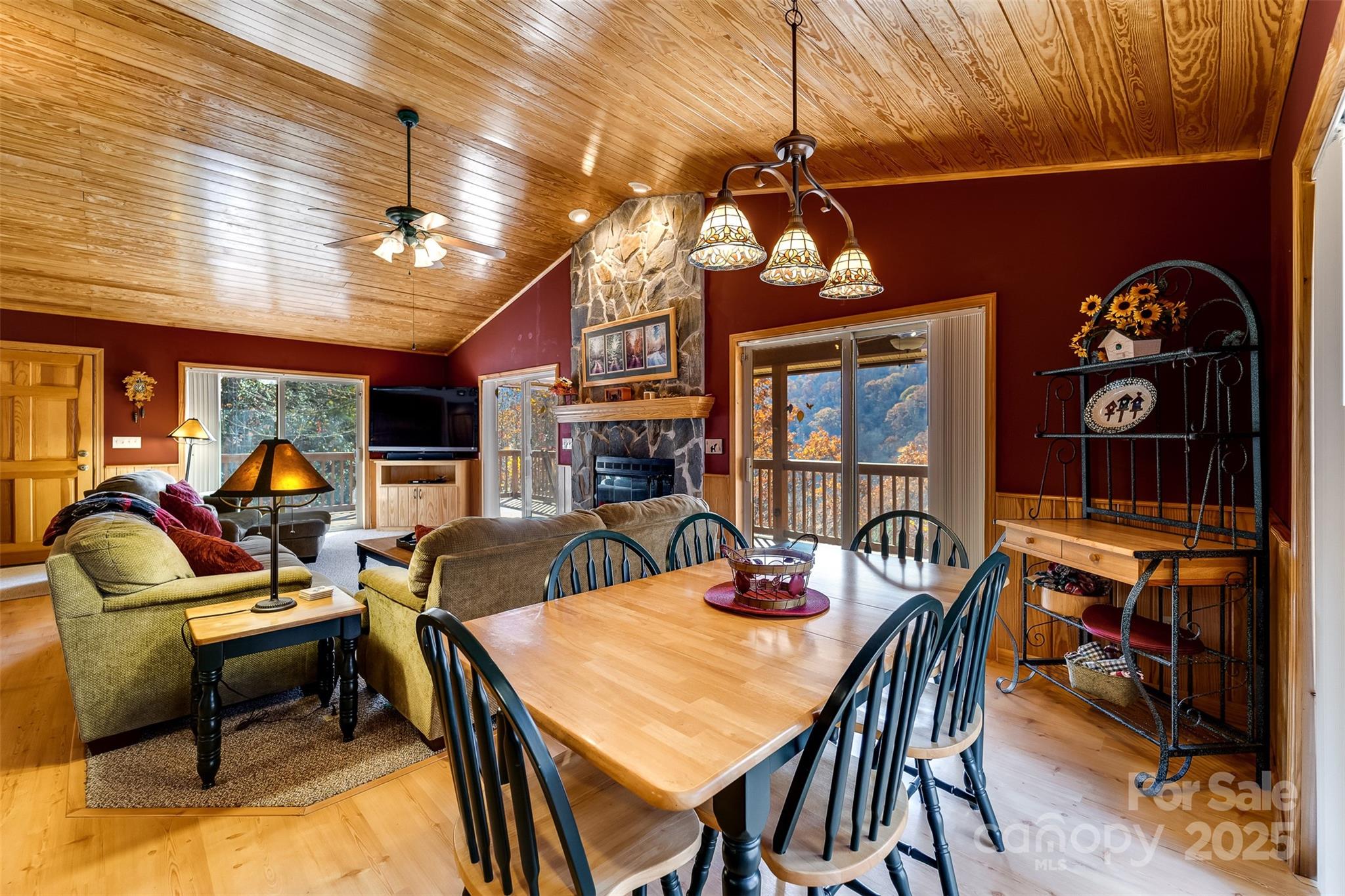 2311 Alarka Road Bryson City, NC 28713 - Photo 11 of 47 a view of a dining room with furniture and chandelier