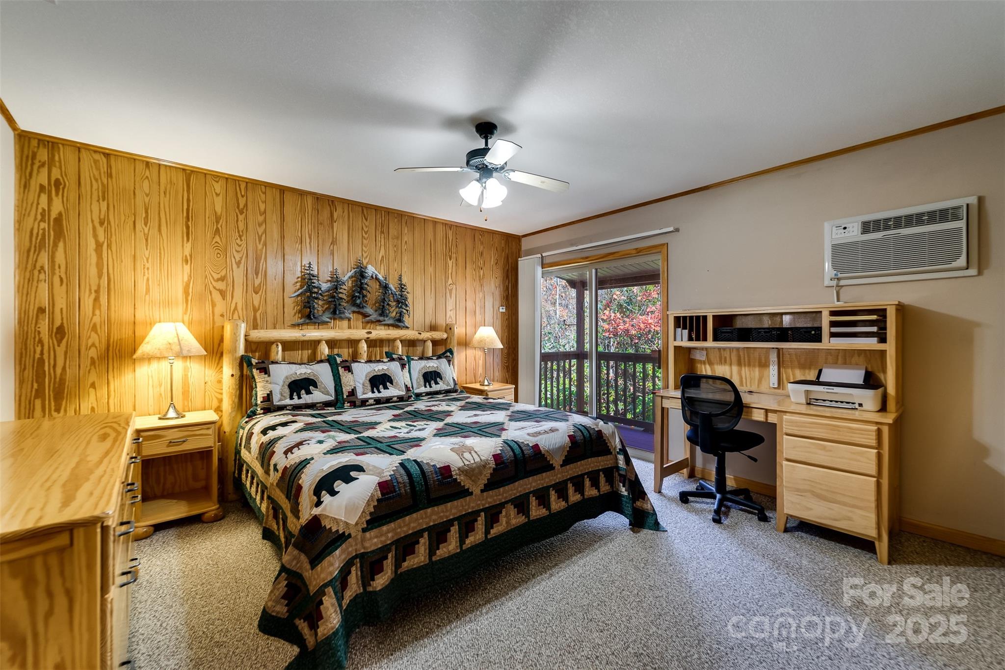 2311 Alarka Road Bryson City, NC 28713 - Photo 20 of 47 a bedroom with a bed and a chandelier