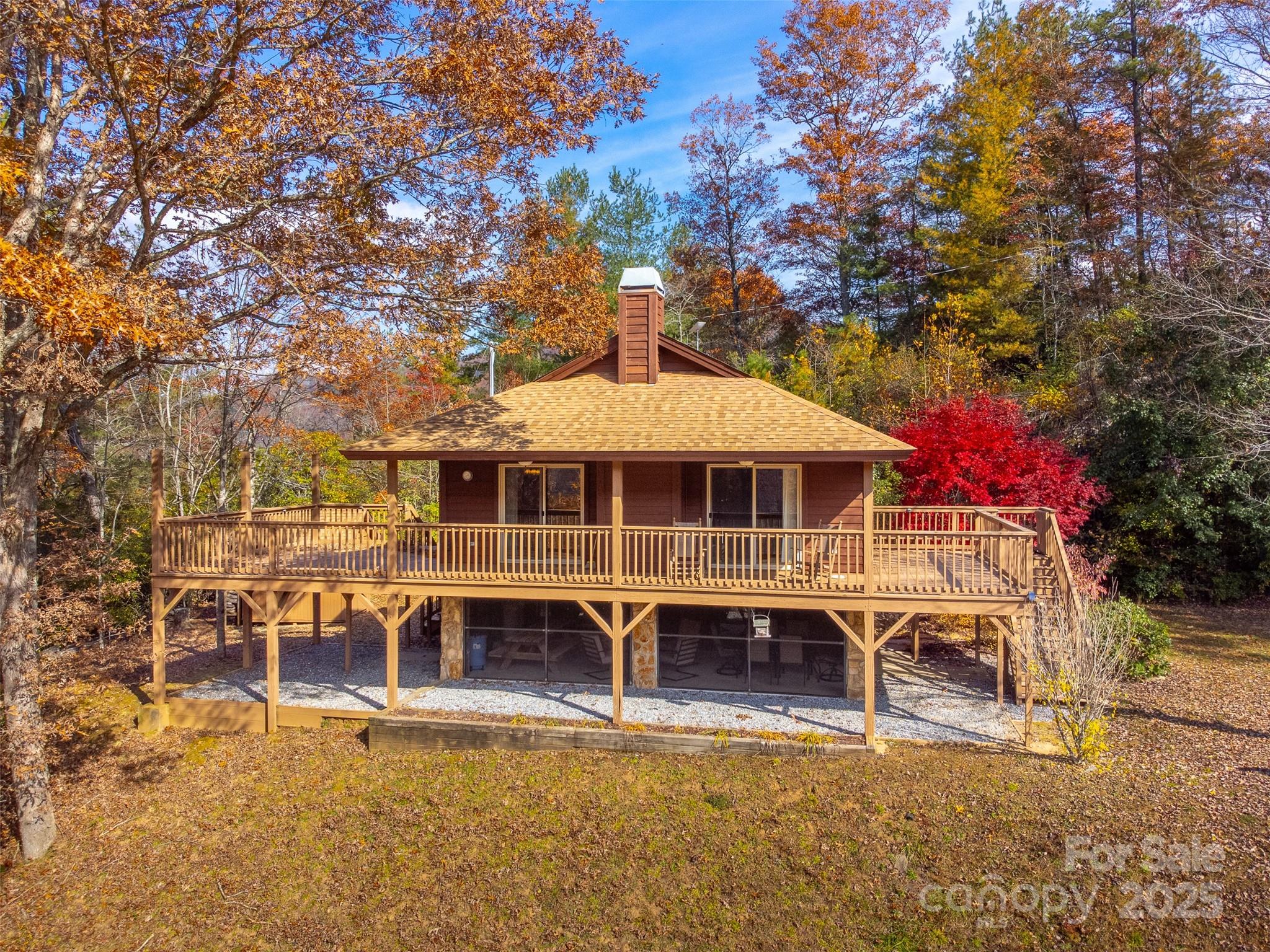 2311 Alarka Road Bryson City, NC 28713 - Photo 2 of 47 an aerial view of a house with a yard table and chairs