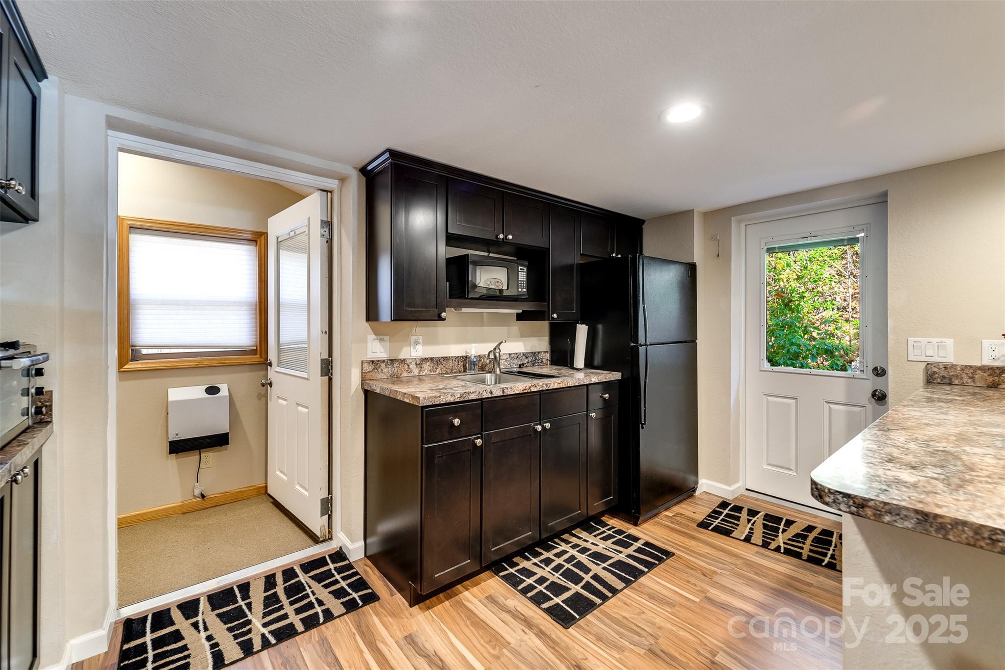 2311 Alarka Road Bryson City, NC 28713 - Photo 23 of 47 a kitchen with a refrigerator and a stove