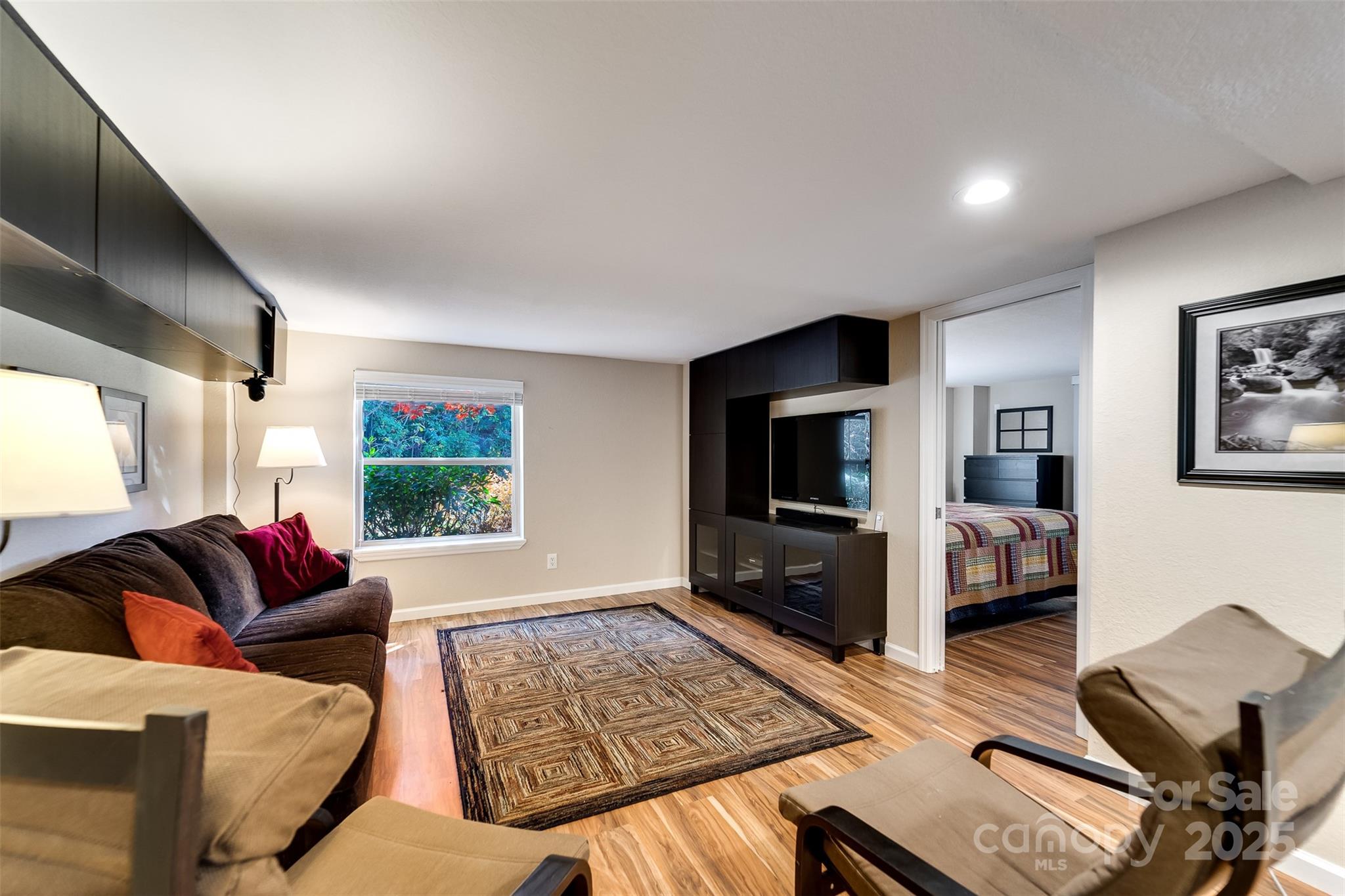 2311 Alarka Road Bryson City, NC 28713 - Photo 26 of 47 a living room with furniture and a flat screen tv