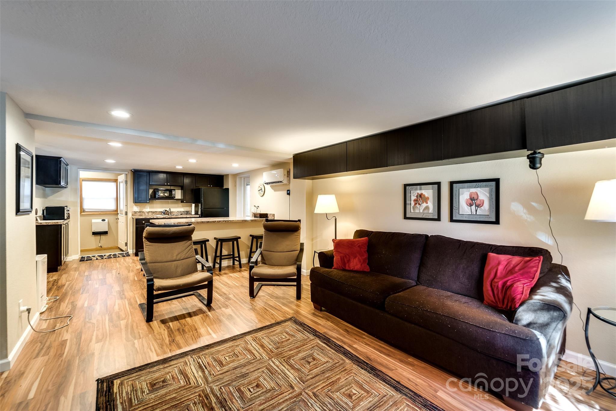 2311 Alarka Road Bryson City, NC 28713 - Photo 27 of 47 a living room with furniture and view of kitchen
