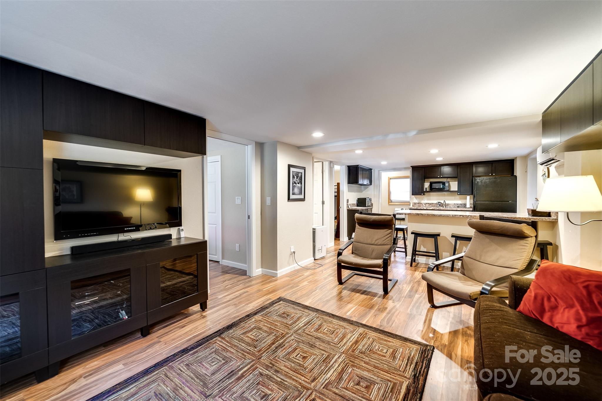 2311 Alarka Road Bryson City, NC 28713 - Photo 28 of 47 a living room with furniture and a flat screen tv