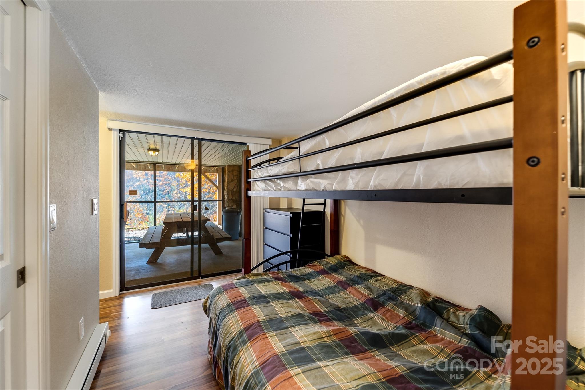 2311 Alarka Road Bryson City, NC 28713 - Photo 29 of 47 a bedroom with a bed and a window