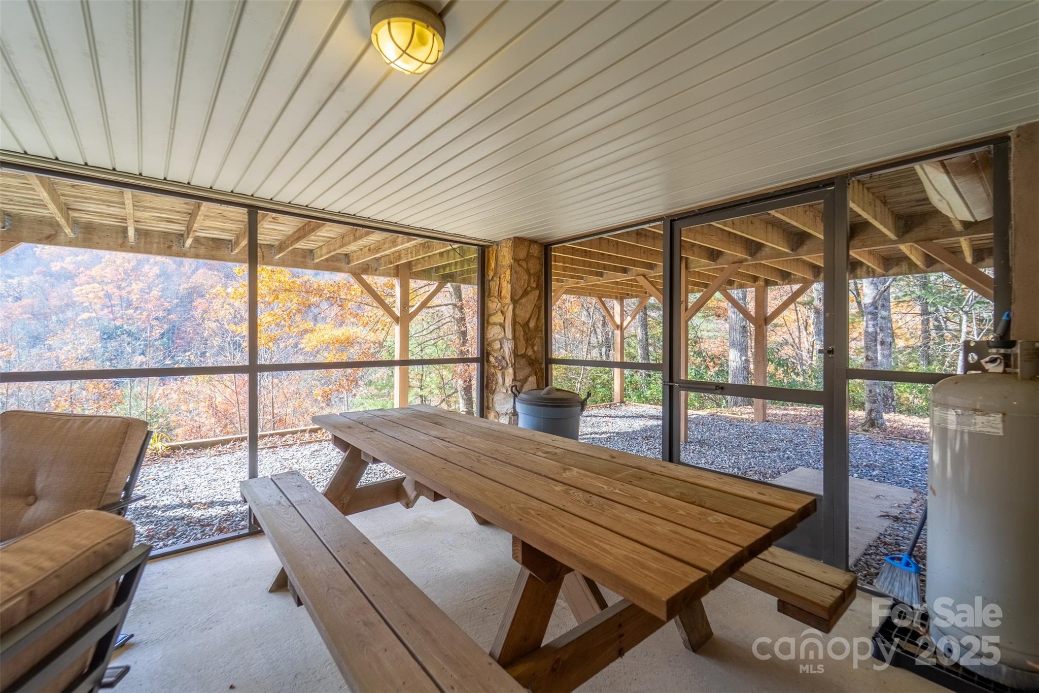 2311 Alarka Road Bryson City, NC 28713 - Photo 39 of 47 a bedroom with furniture and a large window