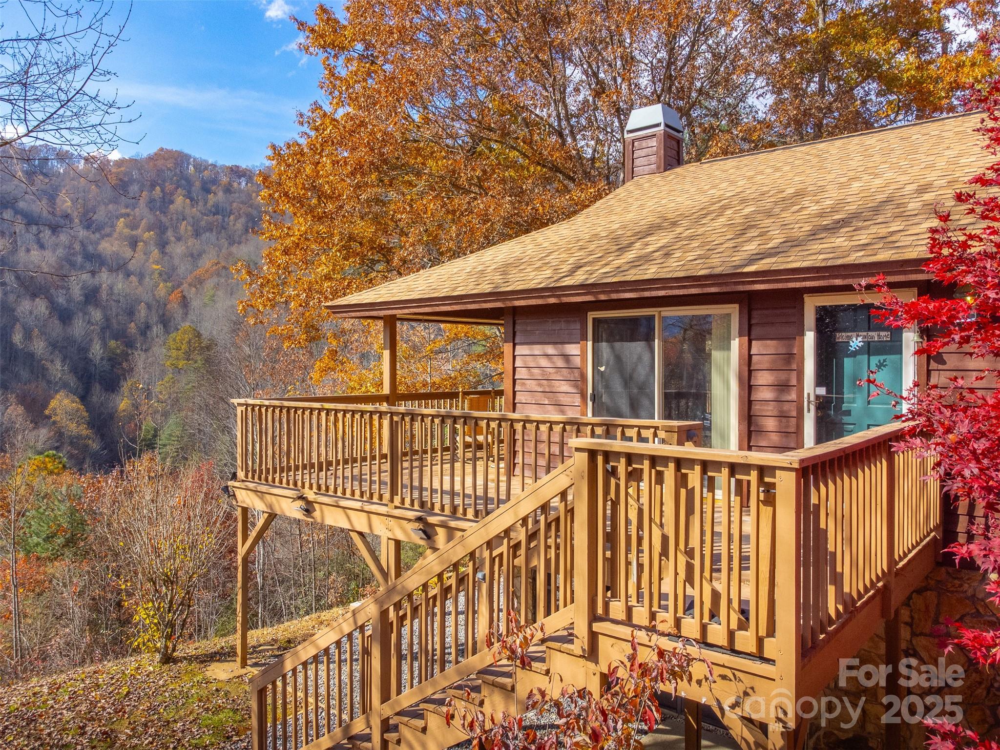 2311 Alarka Road Bryson City, NC 28713 - Photo 4 of 47 a view of a house with iron fence
