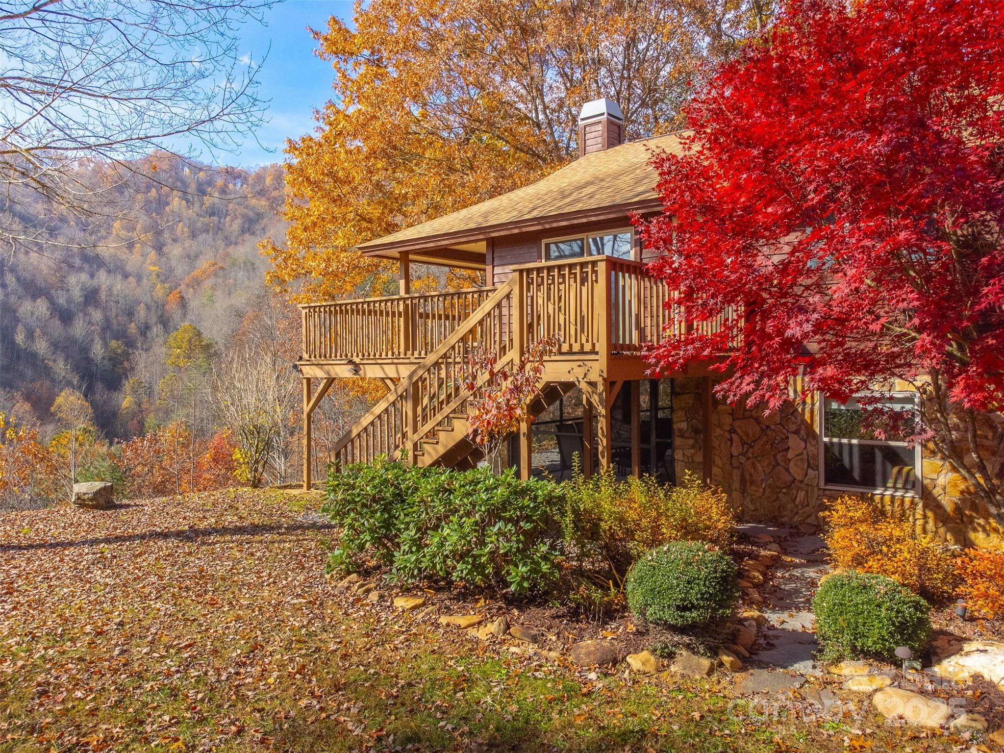 2311 Alarka Road Bryson City, NC 28713 - Photo 5 of 47 a view of a house with a yard