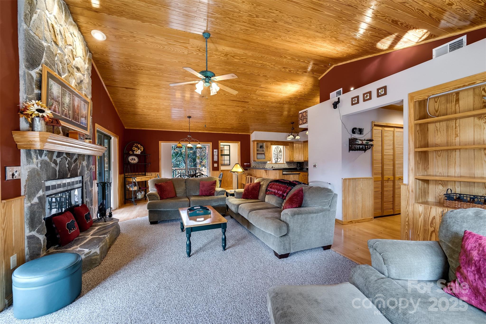 2311 Alarka Road Bryson City, NC 28713 - Photo 8 of 47 a living room with furniture fireplace and a chandelier