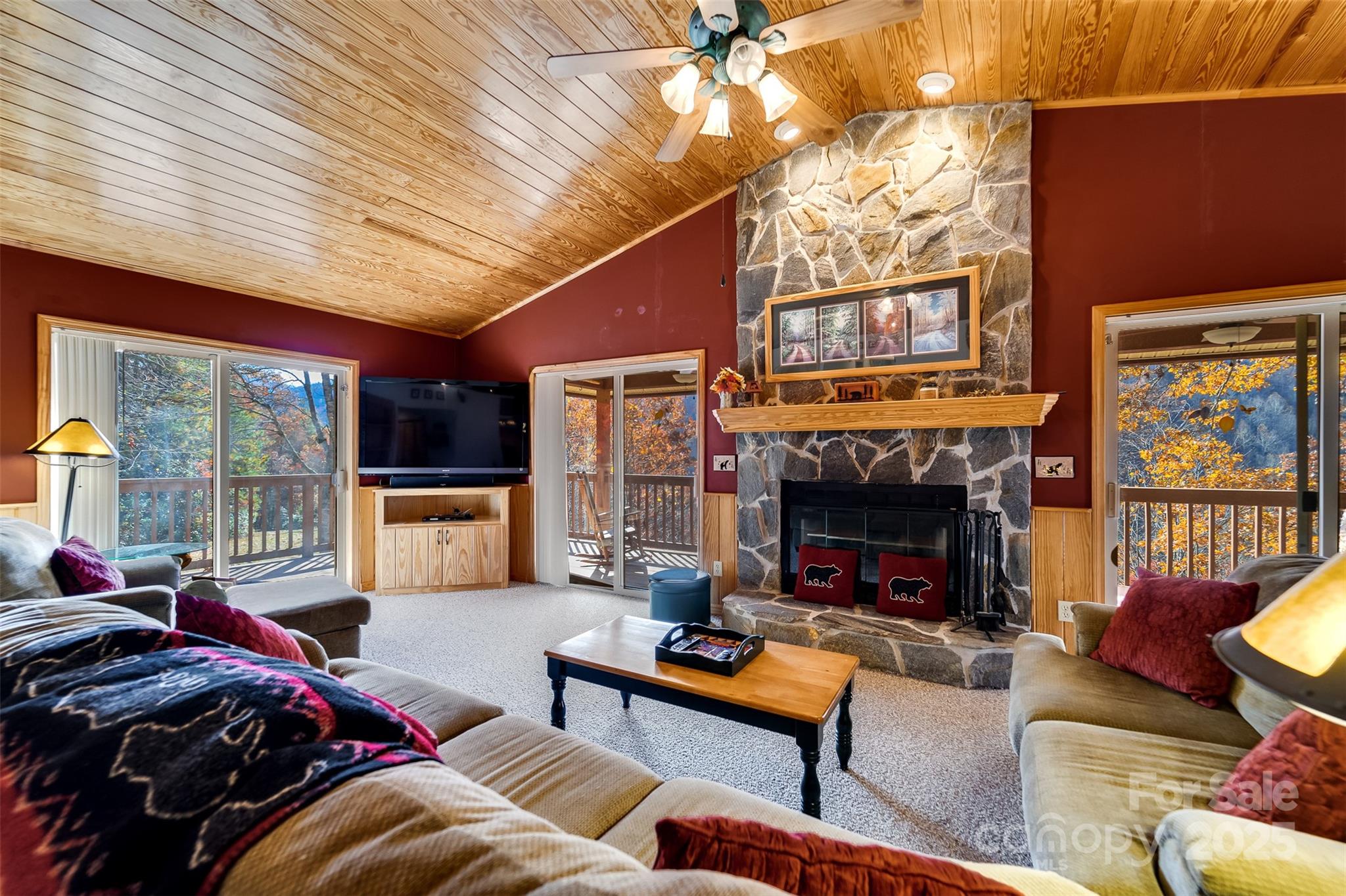 2311 Alarka Road Bryson City, NC 28713 - Photo 9 of 47 a living room with furniture fireplace and flat screen tv