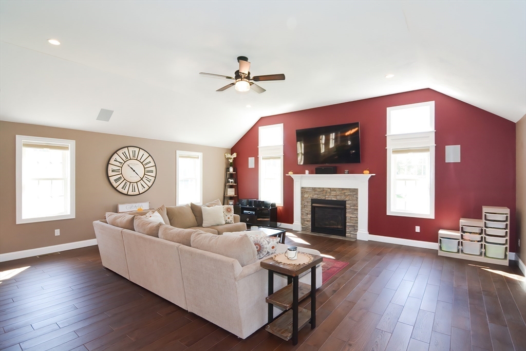 310 Main Street Rutland, MA 01543 - Photo 12 of 39 a living room with furniture a fireplace and a flat screen tv