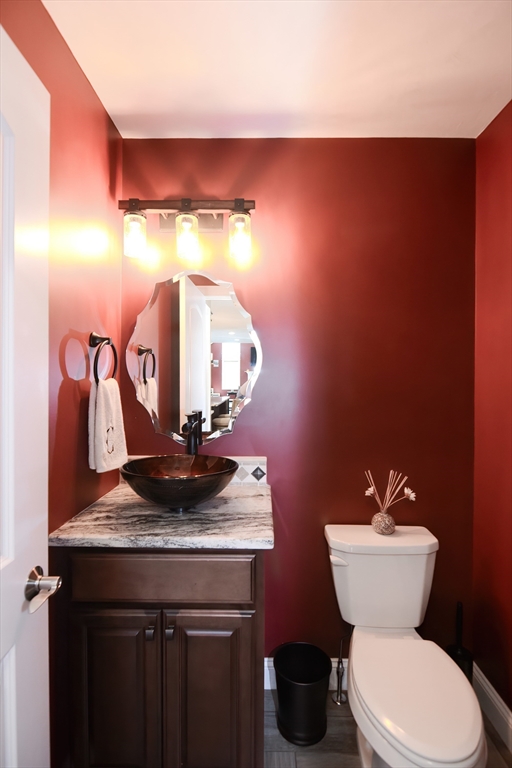 310 Main Street Rutland, MA 01543 - Photo 17 of 39 a bathroom with a toilet sink and mirror