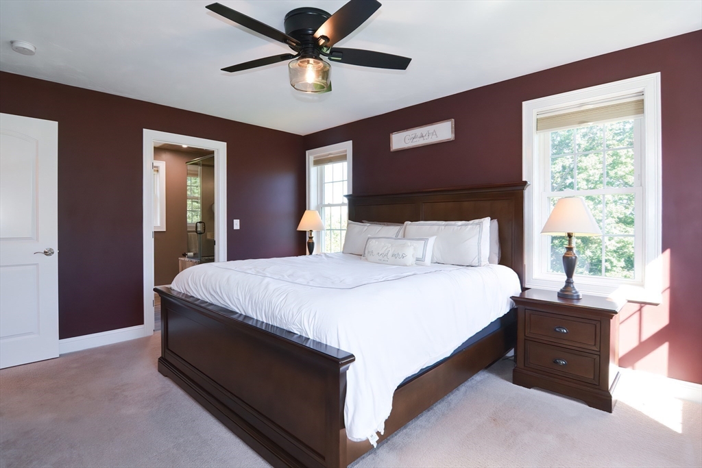310 Main Street Rutland, MA 01543 - Photo 21 of 39 a bed room with a bed and a ceiling fan