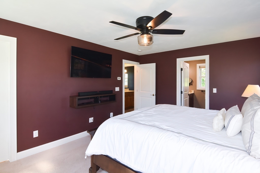 310 Main Street Rutland, MA 01543 - Photo 22 of 39 a bedroom with a bed and a flat screen tv