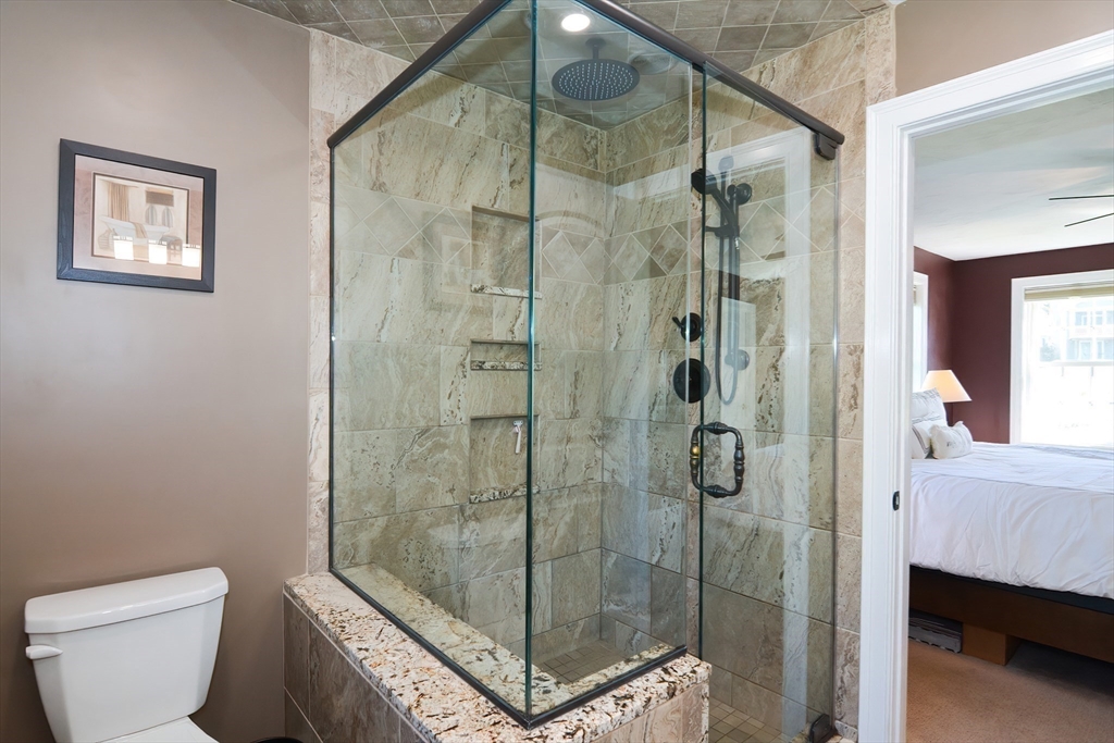 310 Main Street Rutland, MA 01543 - Photo 23 of 39 a bathroom with a shower and toilet