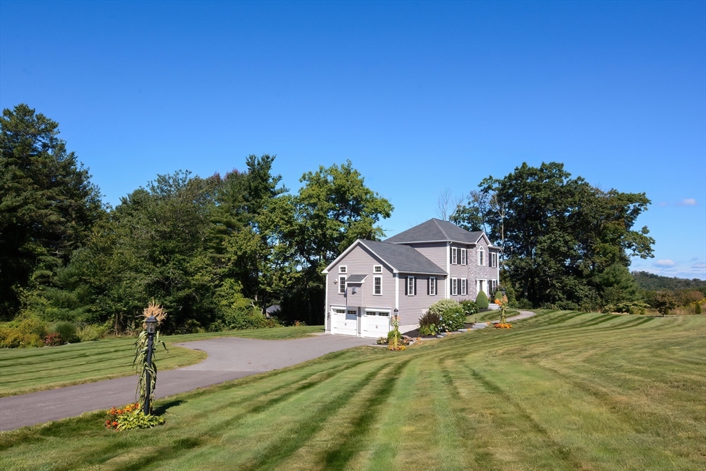 310 Main Street Rutland, MA 01543 - Photo 31 of 39 a front view of a house with a yard