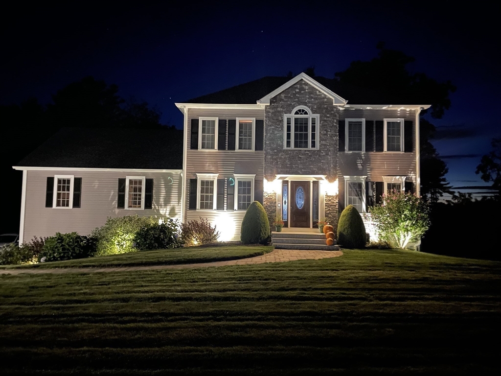 310 Main Street Rutland, MA 01543 - Photo 39 of 39 a front view of a house with a garden