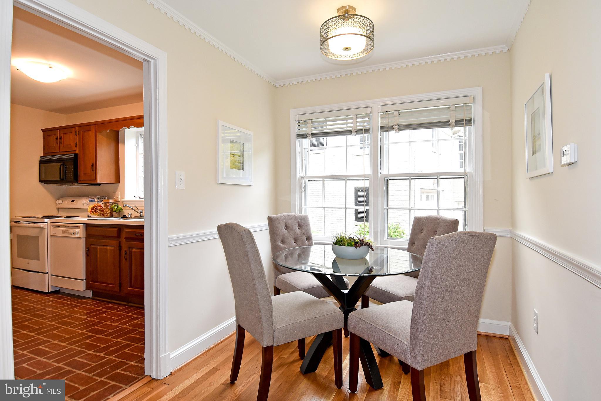 1404 Ruffner Road Alexandria, VA 22302 - Photo 11 of 34 a view of a dining room with furniture and a window
