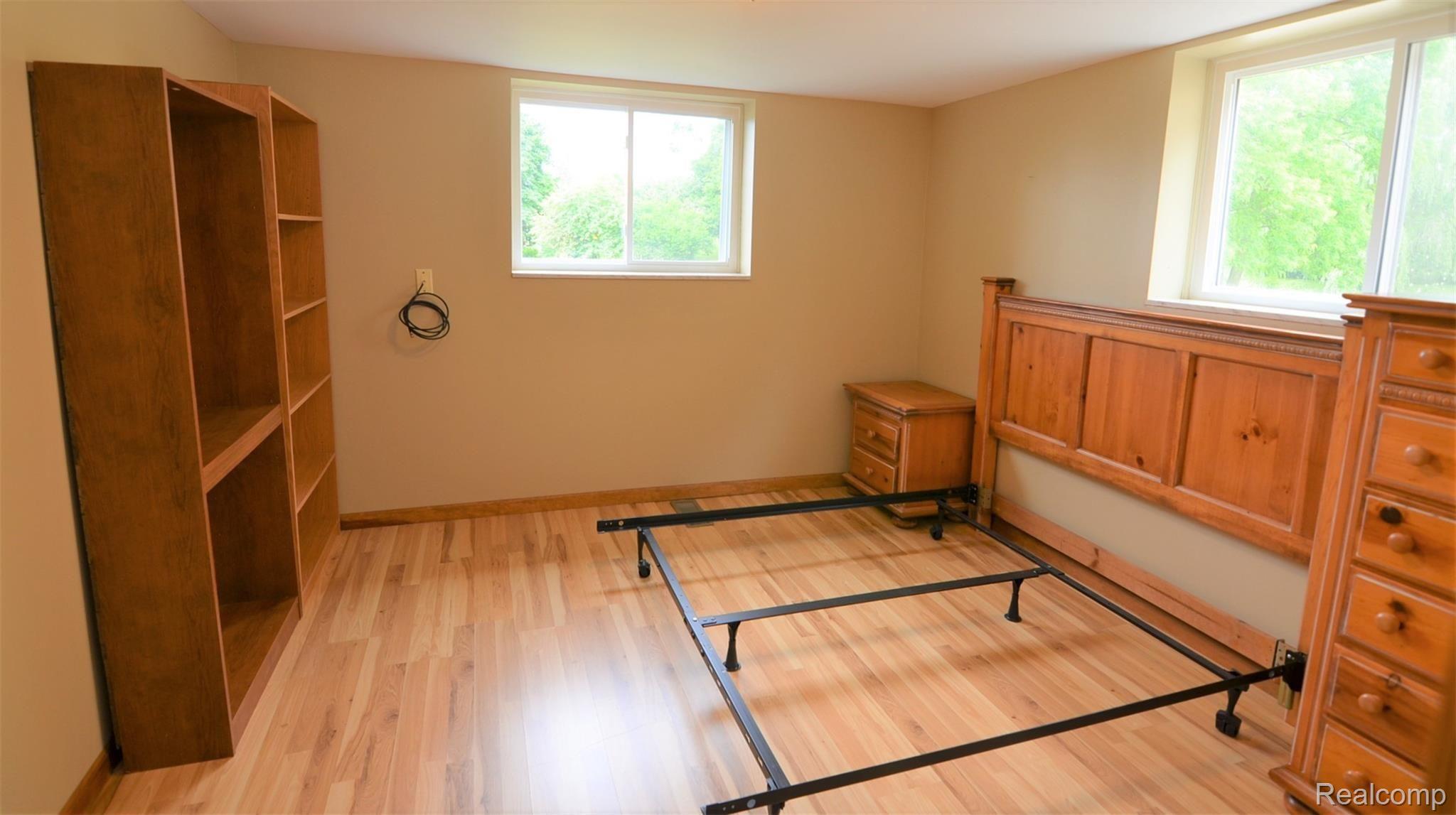 8388 Buckell Lake Road Holly, MI 48442 - Photo 17 of 22 SUNLIT BEDROOMS