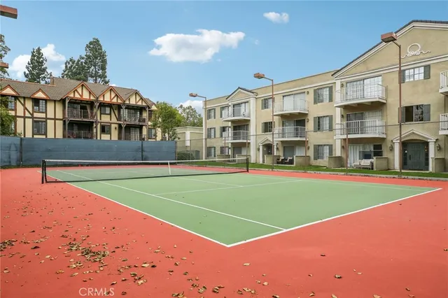 a view of an apartment with a swimming pool