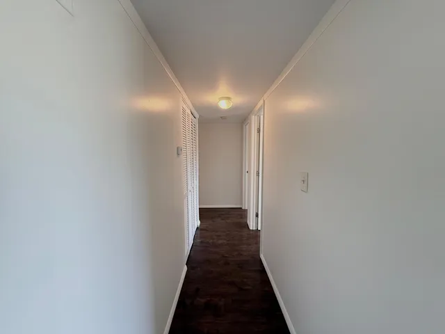 a view of a hallway with a closet