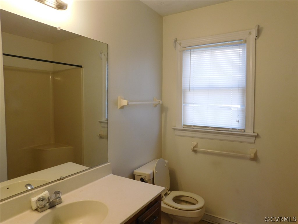 13020 Singer Road Midlothian, VA 23112 - Photo 25 of 33 a bathroom with a sink toilet and shower