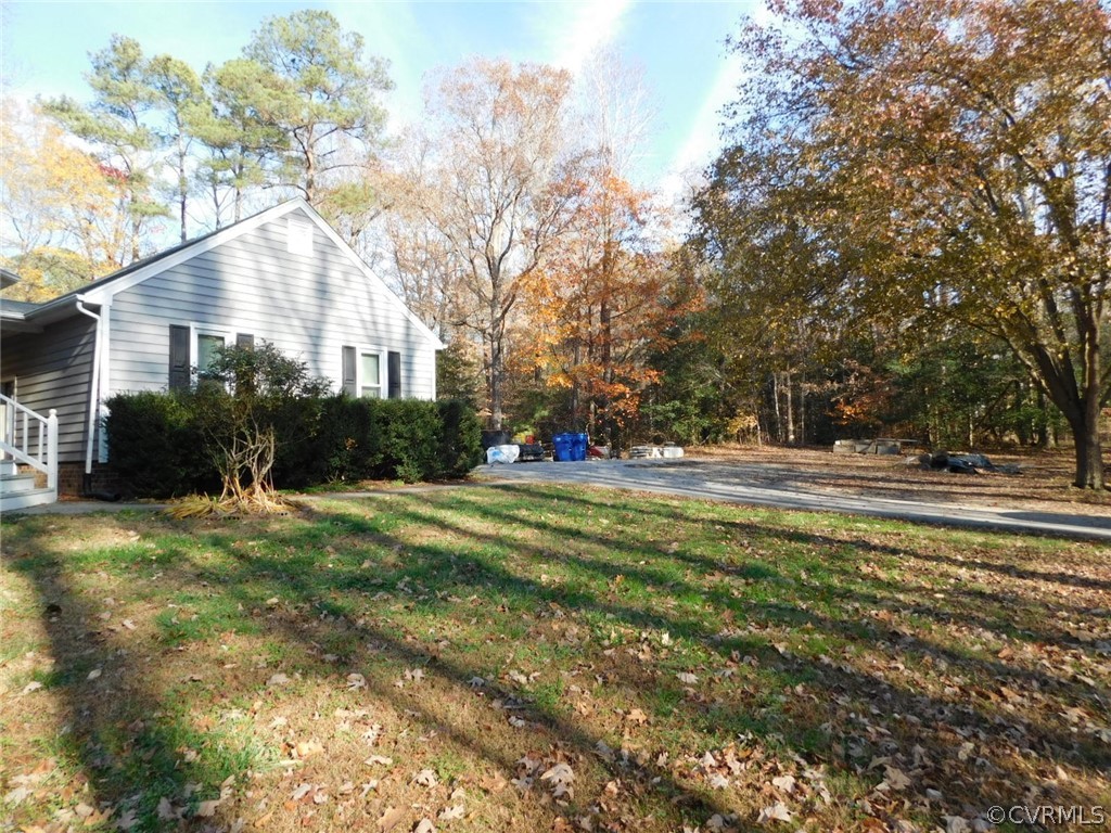 13020 Singer Road Midlothian, VA 23112 - Photo 4 of 33 a view of swimming pool and trees in the background
