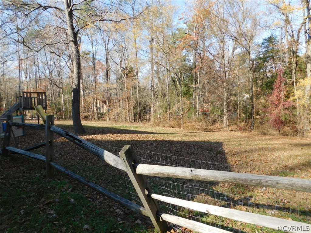 13020 Singer Road Midlothian, VA 23112 - Photo 6 of 33 a view of backyard with wooden fence