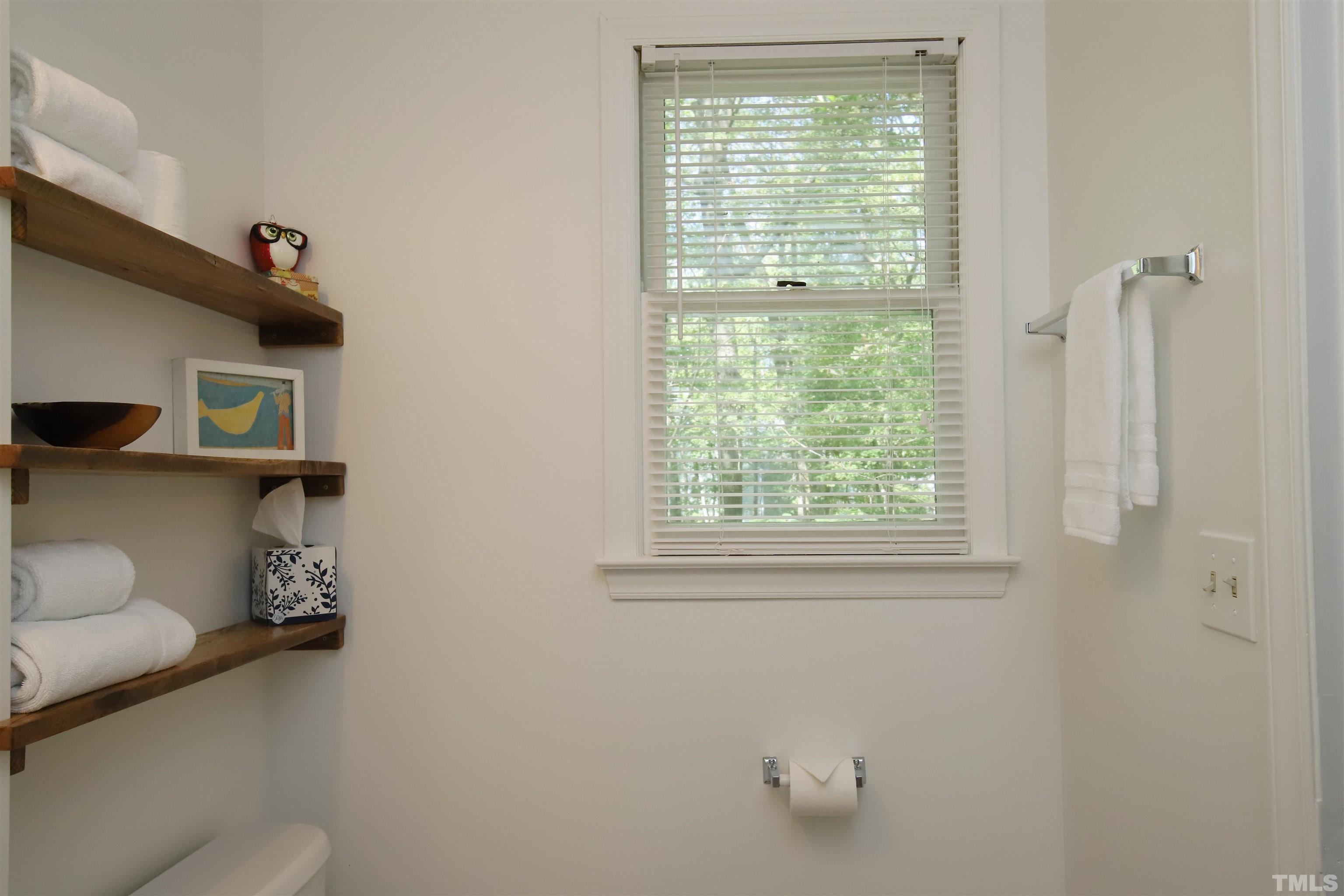 13 Williams Durham, NC 27704 - Photo 14 of 23 a bathroom with a toilet and a window