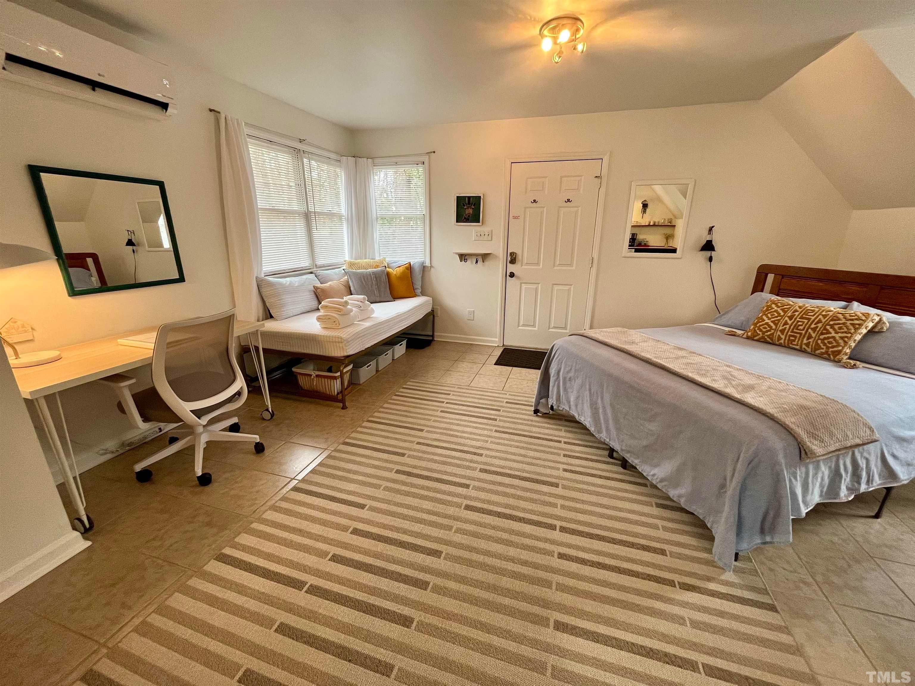 13 Williams Durham, NC 27704 - Photo 15 of 23 a bed room with a bed and a chair