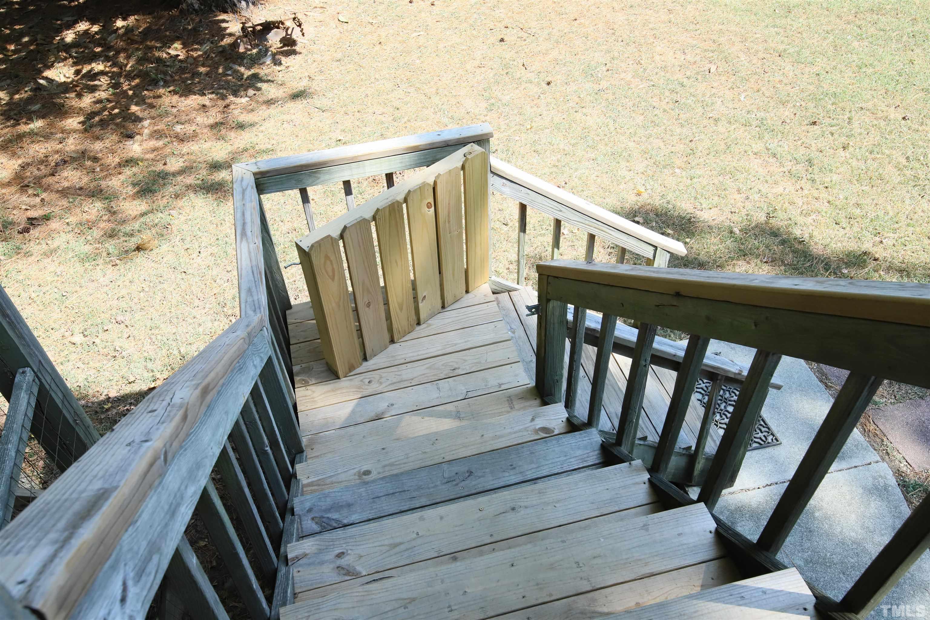 13 Williams Durham, NC 27704 - Photo 18 of 23 a view of balcony with wooden floor and front door
