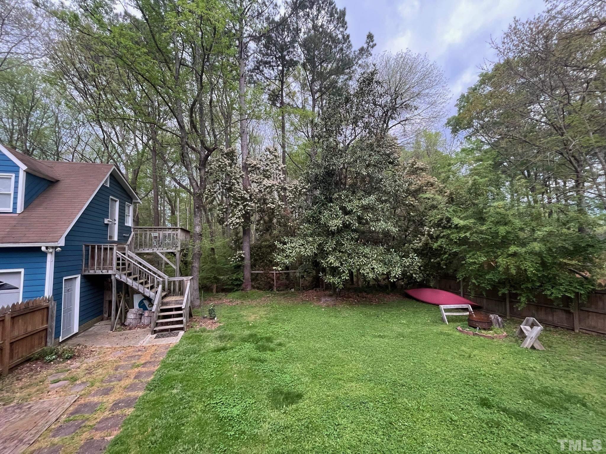 13 Williams Durham, NC 27704 - Photo 20 of 23 a view of a house with a backyard and a large tree
