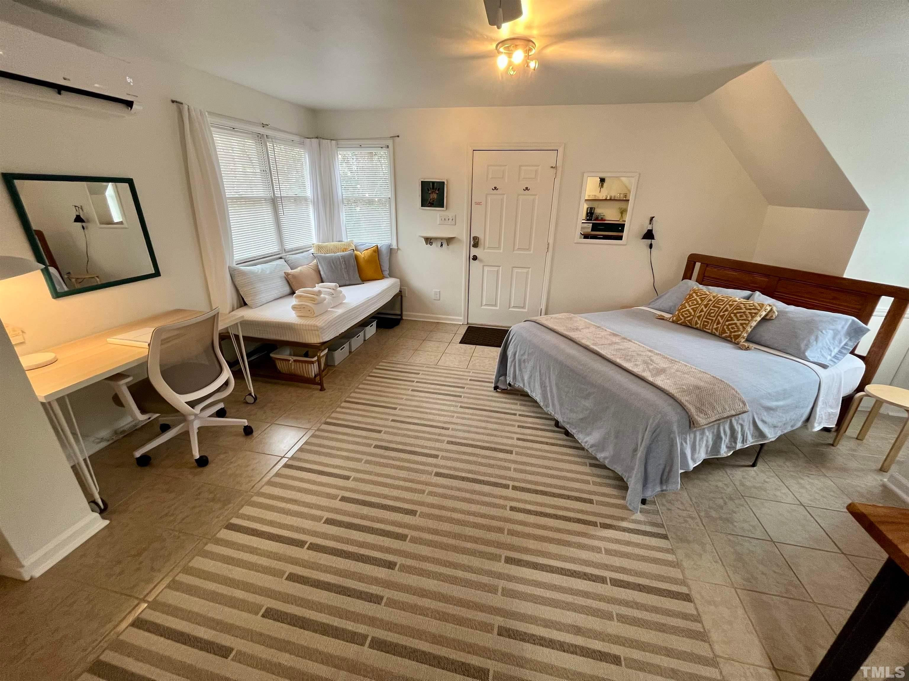 13 Williams Durham, NC 27704 - Photo 4 of 23 a bedroom with a bed and lamp